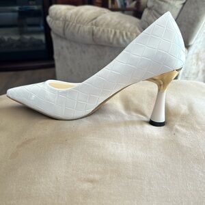 White high heel, beautiful shoe it’s just too big for me
